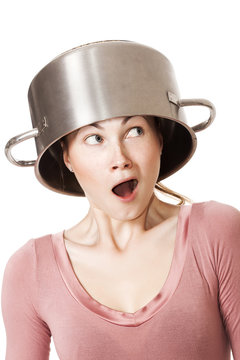 Funny girl wearing pot as hat and looking aside