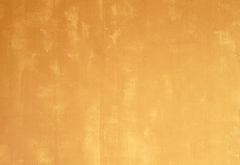 Yellow cement wall, textured background.