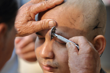 Male who will be monk shaving hair for be Ordained