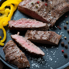Sliced medium grilled beef barbecue steak, close-up, studio shot