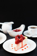 cheesecake with strawberries on a black background