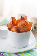 Fried french fries with spices and sauce