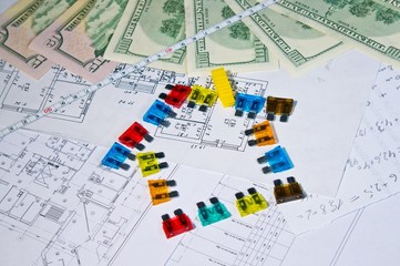 Fototapeta na wymiar fuses and money on construction drawings, the energy concept