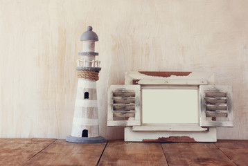old vintage wooden white frame and lighthouse