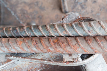 The texture of construction rebar rods stacked in parallel