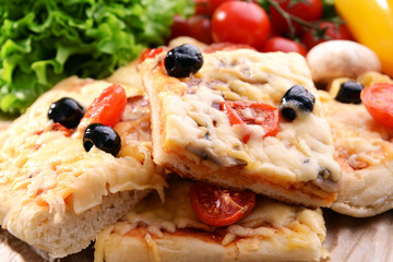 Delicious homemade pizza on table close-up