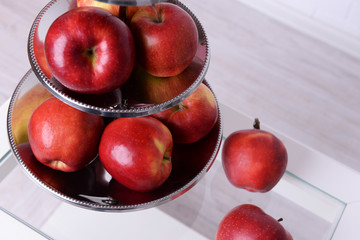 Tasty ripe apples on serving tray on table close up