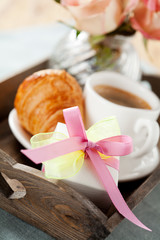 Romantic breakfast with coffee and croissant