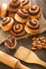 baked scones on the table near cinnamon and nuts with a rolling