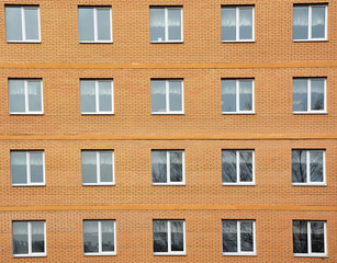 Architectural background- windows and home wall from yellow brick