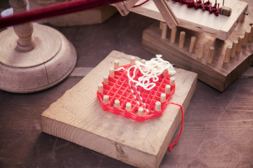 Example of frame of yesteryear for weaving and embroidery wool in a tuscany typical representation