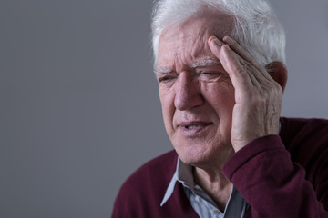 Old man has headache