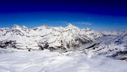 Fototapeta na wymiar snow alps mountains view and blue sky