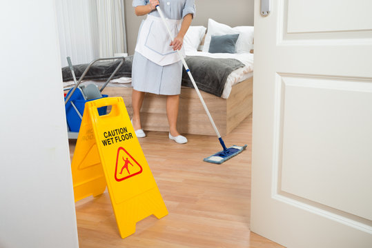 Female Maid Cleaning Floor