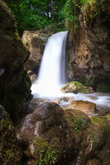 Beautiful small waterfall landscape in the mountains.