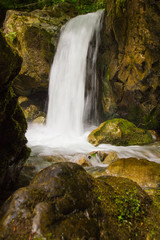 Beautiful small waterfall landscape in the mountains.