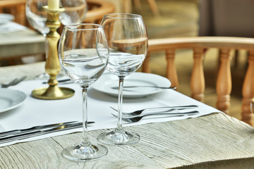 Table setting with wine glasses at the vintage cafe.