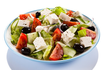 Greek salad on white background