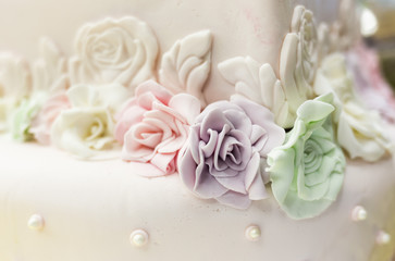 Colorful candy roses on a cake