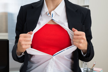 Businesswoman Tearing Her Shirt Showing Red Costume