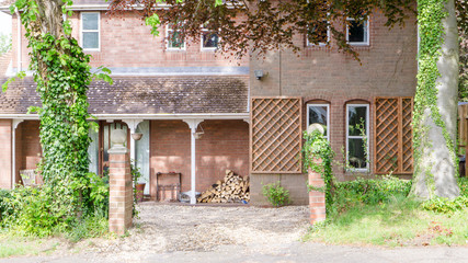 Fototapeta na wymiar Old English house with wooden logs