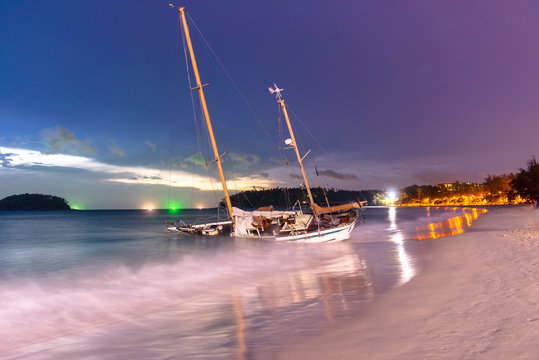 Fototapeta yacht at beach twilight khuket thailand