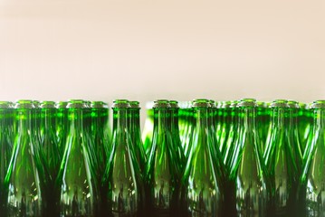 Many bottles on conveyor belt