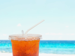 Close up ice tea in plastic disposable cup
