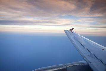 Fototapeta na wymiar Sunset over the sea viewed from airplane