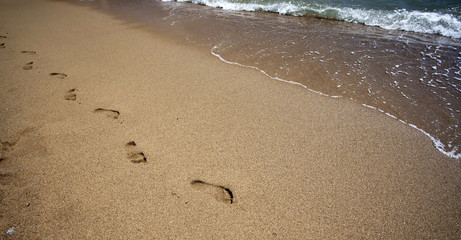 Footsteps in the sand - retro photo