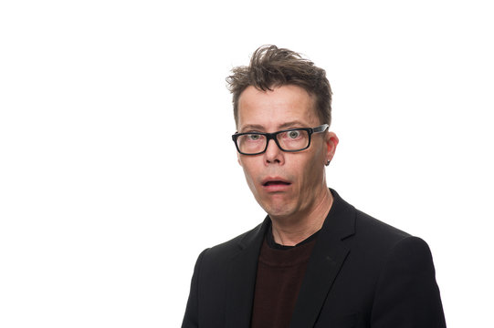 Shocked Businessman with Glasses Looking at Camera