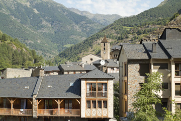 Fototapeta na wymiar Stone houses and church in the village of Ordino. Andorra