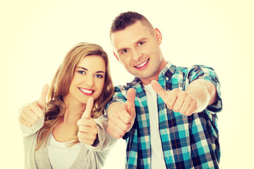 Couple showing thumbs up