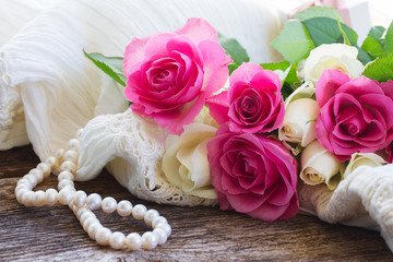 pink and orange roses with lace