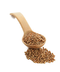 Buckwheat in wooden spoon on white.