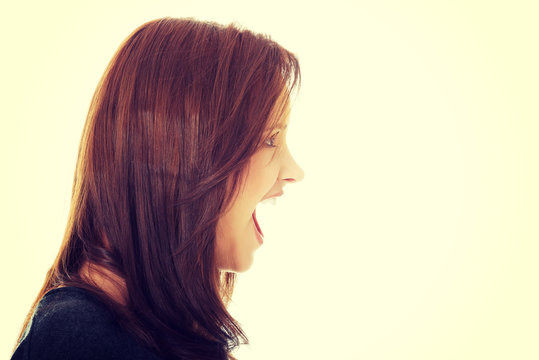 Frustrated and angry woman screaming.
