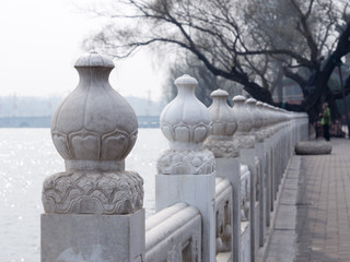 Fototapeta na wymiar Oriental stone fence in Beihai park