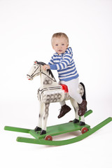 Boy and wooden rocking horse