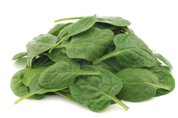 fresh spinach leaves on a white background
