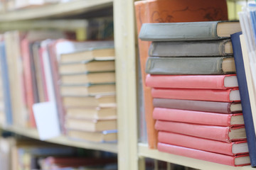 The image of books on the shelf in a library. 