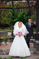 bride and groom in autumn park