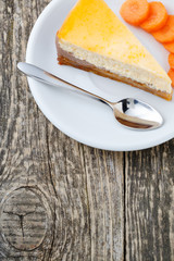 Sweet slice of carrot cake on white plate.