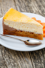 Sweet slice of carrot cake on white plate.