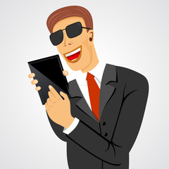 smiling business man holding tablet