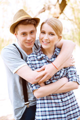 Fototapeta premium Young man embracing his girlfriend 