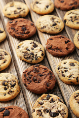 Chocolate chip cookies on brown wooden background
