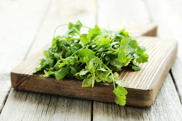 Parsley on grey wooden background
