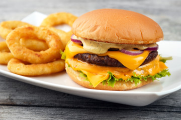 Cheeseburger served with deep fry onion rings