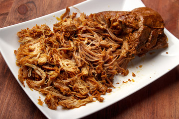 Oven made warm pulled pork , partially ripped 