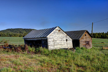 Fototapeta na wymiar Two old sheds.